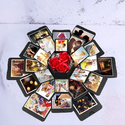 Exploding photo gift box opened to reveal printed pictures and a red paper rose